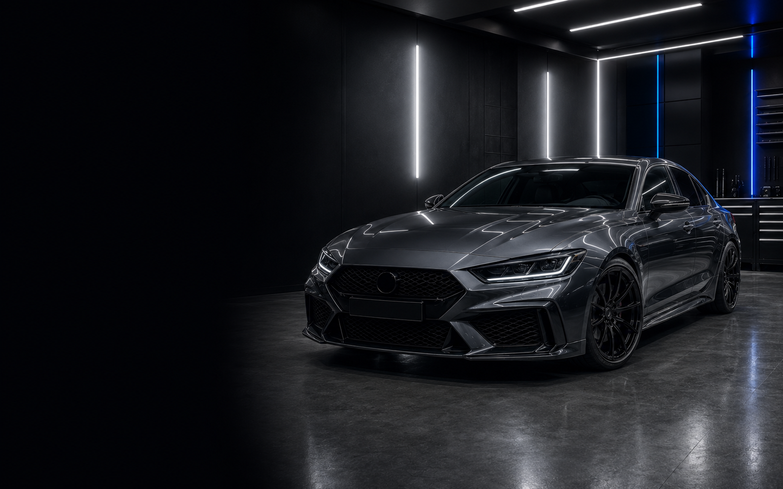 A freshly detailed graphite performance sedan in a premium automotive studio