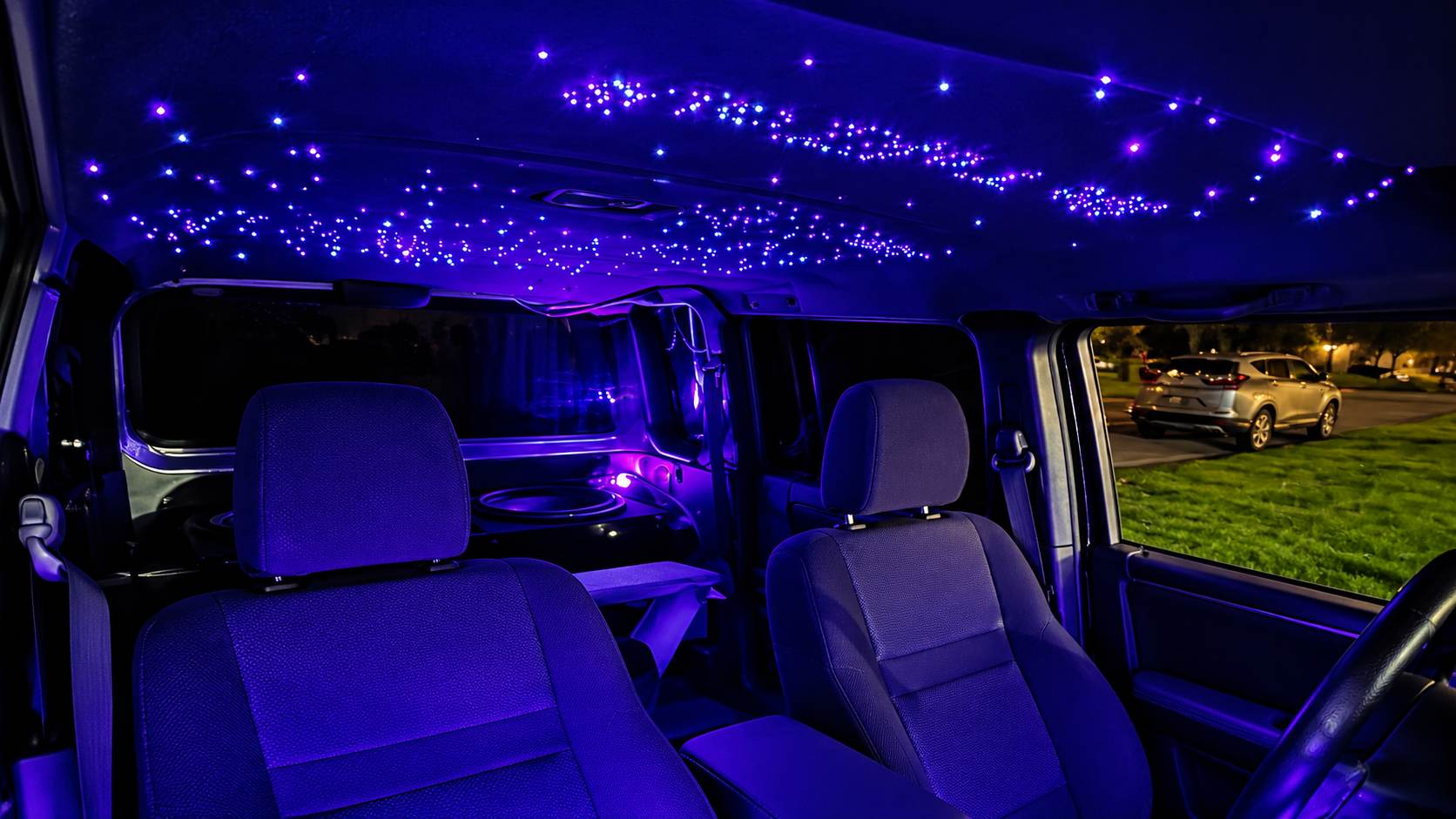 Illustration of a vehicle interior with a blue-violet starlight headliner